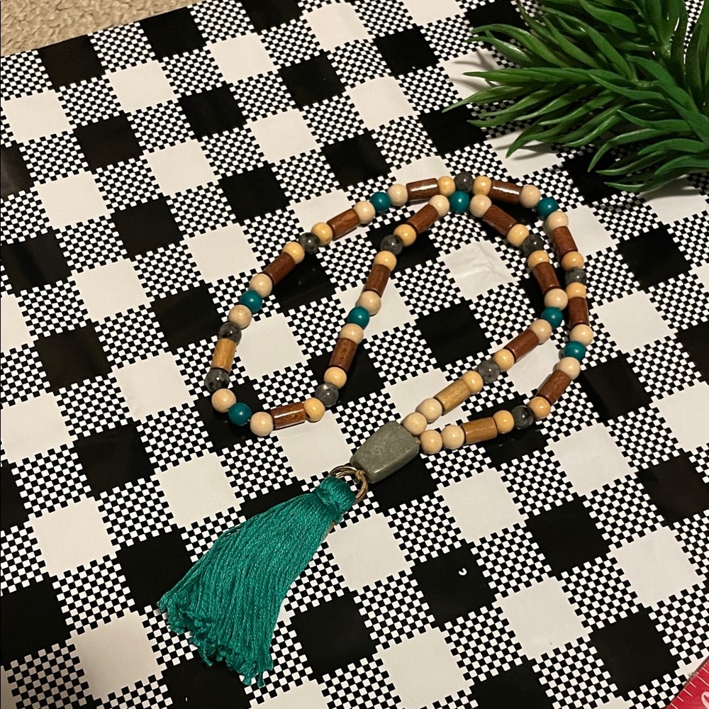 Hand assembled beaded necklace turquoise cotton tassel